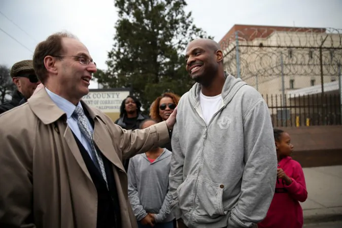 Eddie Bolden takes his first steps as a free man outside the Cook County Jail, after his release from prison,on Tuesday, April 19, 2016, in Chicago. A Cook County judge threw out the murder convictions of the long time inmate, and prosecutors declined to retry him. (Erin Hooley/Chicago Tribune via AP)