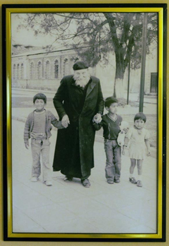 Father Crespi with some local children. (Crespi Museum in the Universidad Politécnica Salesiana)