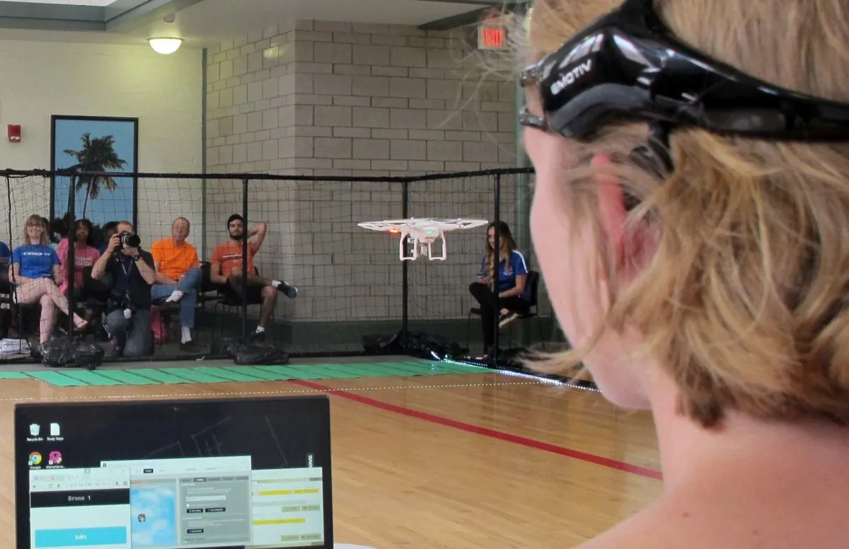 A University of Florida student uses a brain-controlled interface headset to fly a drone during a mind-controlled drone race in Gainesville, Fla., on April 16, 2016. (Jason Dearen/AP Photo)