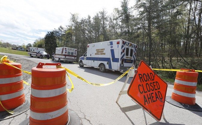 Law enforcement has closed down Union Hill Road in Pike County, Ohio, while they investigate a shooting with multiple fatalities on Friday, April 22, 2016.  Authorities say multiple people have been shot to death in rural Ohio, some 70 miles east of Cincinnati.  (Chris Russell/The Columbus Dispatch via AP)