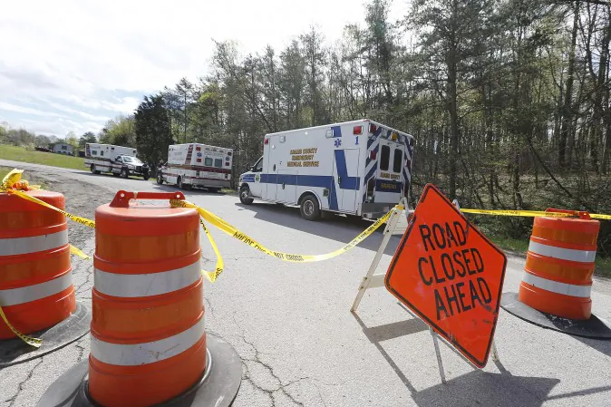 Law enforcement has closed down Union Hill Road in Pike County, Ohio, while they investigate a shooting with multiple fatalities on Friday, April 22, 2016.  Authorities say multiple people have been shot to death in rural Ohio, some 70 miles east of Cincinnati.  (Chris Russell/The Columbus Dispatch via AP)