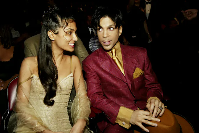 Singer Prince (R) and his then wife Manuela Testolini sit in the audience at the 35th Annual NAACP Image Awards held at the Universal Amphitheatre in Hollywood, Calif., on March 6, 2004. (Frank Micelotta/Getty Images)