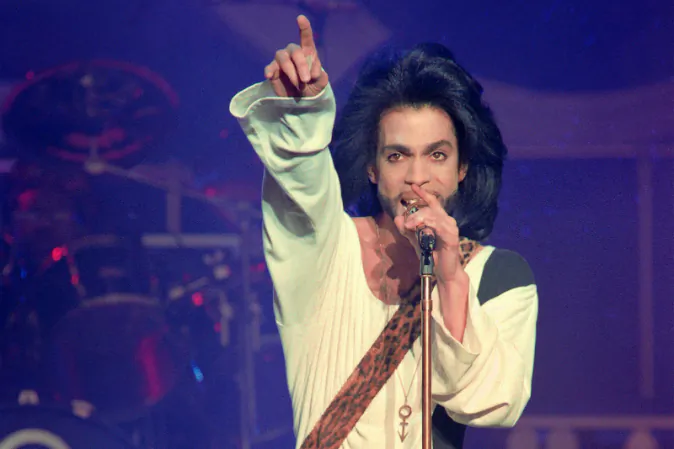 This photo taken on June 16, 1990 shows musician Prince performing on stage during his concert at the Parc des Princes stadium in Paris. (BERTRAND GUAY/AFP/Getty Images)
