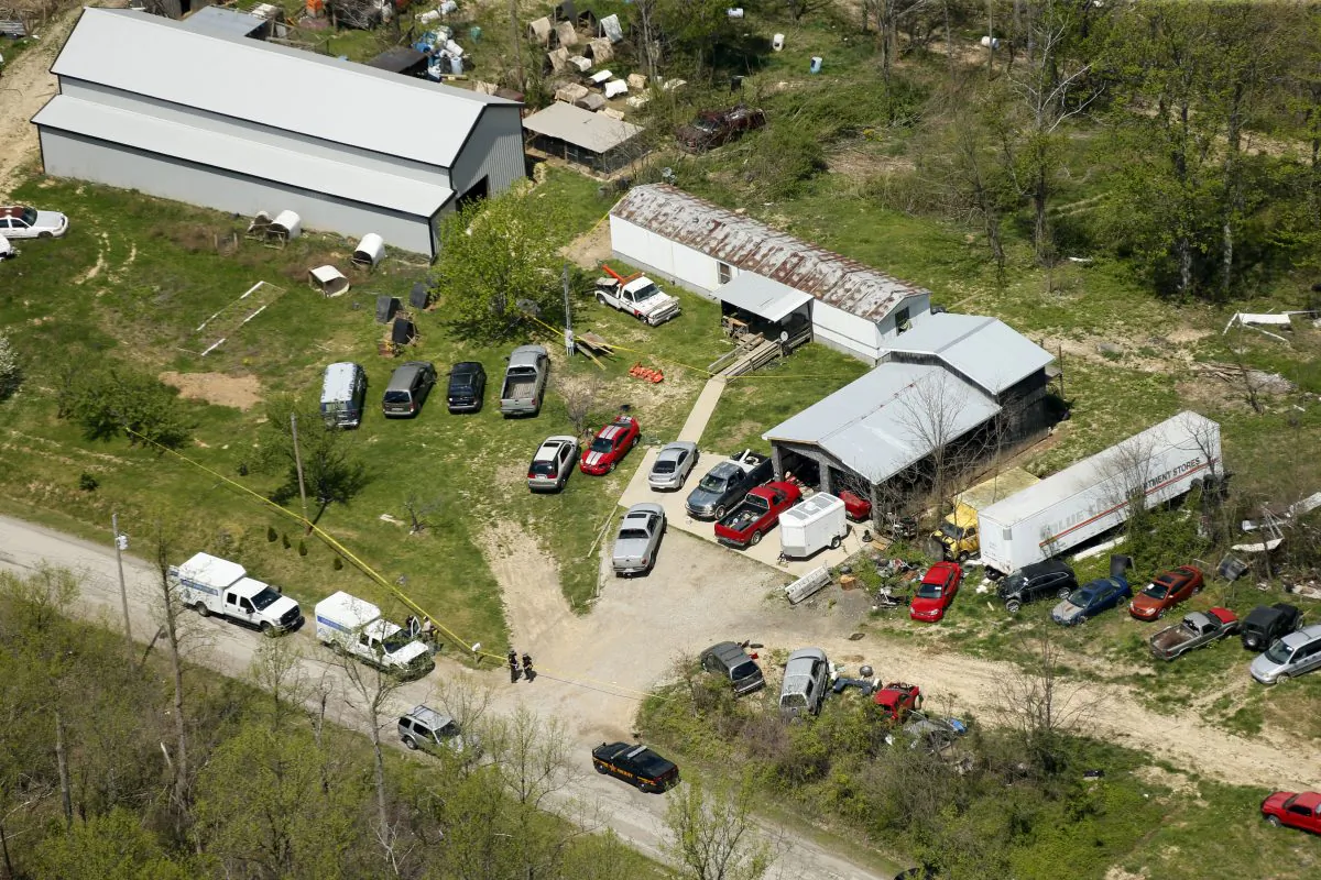 This aerial photo shows one of the locations being investigated in Pike County, Ohio, as part of an ongoing homicide investigation, on April 22, 2016. Several people were found dead Friday at multiple crime scenes in rural Ohio, and at least most of them were shot to death, authorities said. No arrests had been announced, and it's unclear if the killer or killers are among the dead. (Lisa Marie Miller/The Columbus Dispatch via AP)