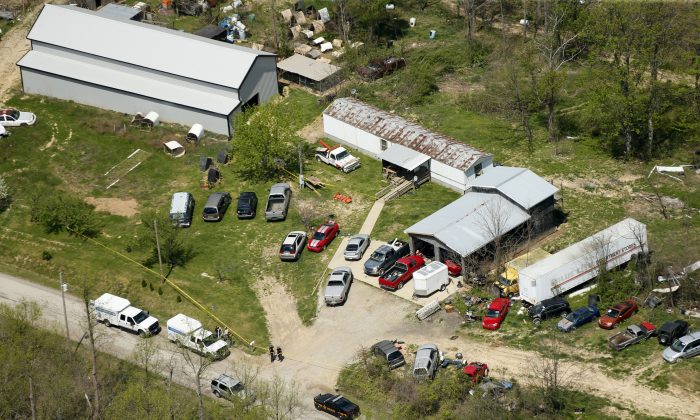 This aerial photo shows one of the locations being investigated in Pike County, Ohio, as part of an ongoing homicide investigation, on April 22, 2016. Several people were found dead Friday at multiple crime scenes in rural Ohio, and at least most of them were shot to death, authorities said. No arrests had been announced, and it's unclear if the killer or killers are among the dead. (Lisa Marie Miller/The Columbus Dispatch via AP)