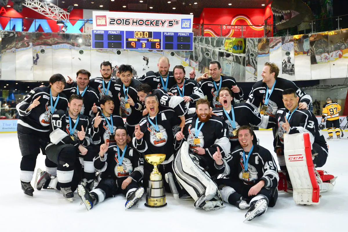 South China Sharks celebrate winning the CIHL playoffs to take the Quam Cup at Mega Ice on Thursday April 21, 2016.  (Bill Cox/Epoch Times)
