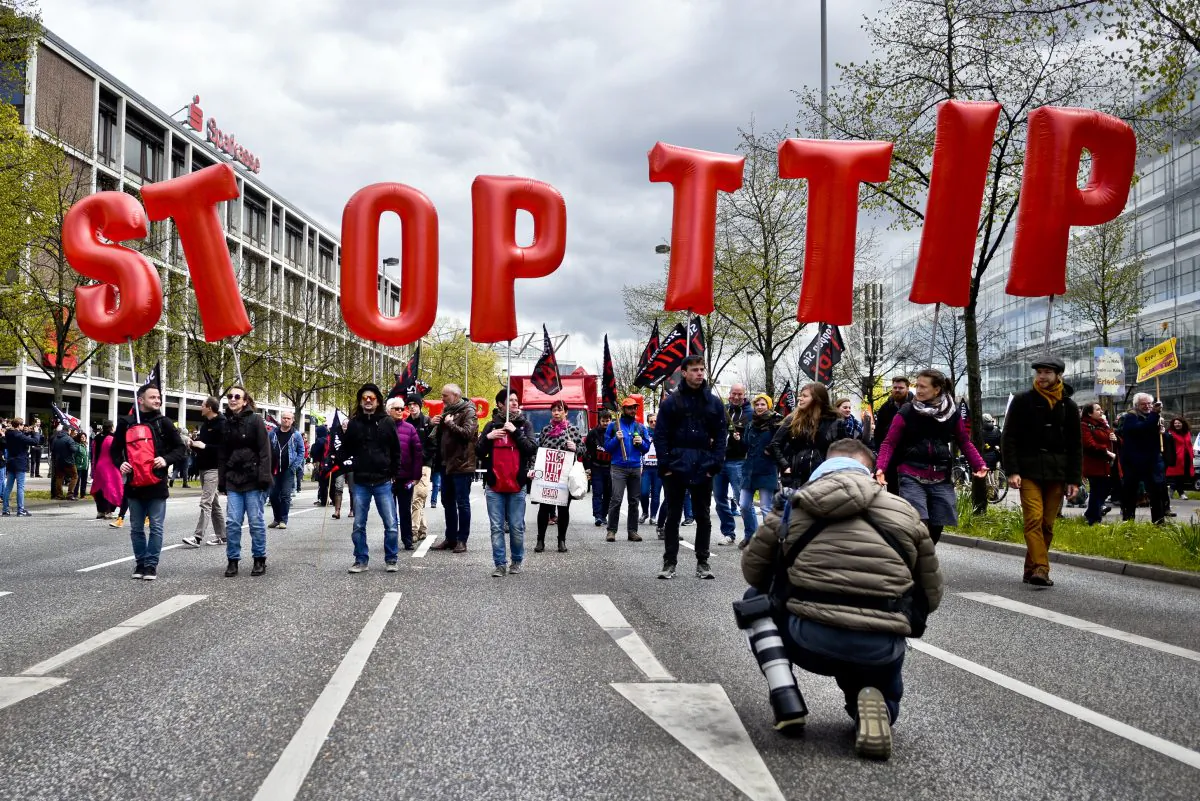 Protesters rallying against the TTIP and CETA free trade agreements march on the eve of a visit by President Barack Obama in Hanover, Germany, on April 23, 2016. Many in Germany are wary of the agreements and claim that both TTIP, a free trade agreement being negotiated between the E.U. and U.S., and CETA, a similar agreement between the E.U. and Canada, will have far-reaching negative impacts in Europe that include labor, economic, environmental, and legal aspects. (Sascha Schuermann/Getty Images)