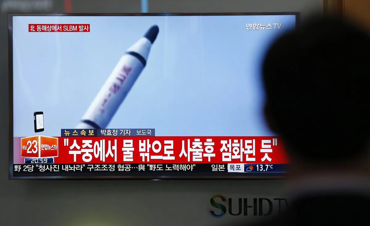 A man watches a TV news program showing a file footage of a missile launch conducted by North Korea, at the Seoul Train Station in Seoul, South Korea, on April 23, 2016. (AP Photo/Lee Jin-man)