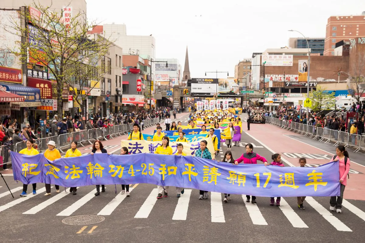 Falun Gong practitioners march in a parade in Flushing, New York, on April 23, 2016, calling for an end to the persecution of Falun Gong in China. (Larry Dye/Epoch Times)