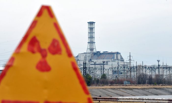A radioactivity sign outside the fourth nuclear reactor at the former Chernobyl Nuclear power plant, site of the world's worst nuclear disaster,  is pictured on April 4, 2011. A project to build a new sarcophagus over the damaged Chernobyl nuclear reactor lacks some 600 million euros of the 1.5 billion needed, a Ukrainian official said said last week.  The concrete sarcophagus capping the reactor has developed cracks over the past 25 years and is not considered failsafe. AFP PHOTO / SERGEI SUPINSKY (Photo credit should read SERGEI SUPINSKY/AFP/Getty Images)