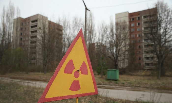 On April 9, 2016, there is a sign warning of radioactive contamination near an old apartment in Pripyat near Chernobyl, Ukraine.  Built in the 1970s as a model Soviet city for accommodating workers and families at the Chernobyl nuclear power plant, Pripyat is now standing. Abandoned in the Chernobyl exclusion zone. This is the world's worst civilian nuclear accident that spewed fallout around the world, a restricted area contaminated with radiation from the collapse of Reactor 4 in 1986 at the nearby Chernobyl power plant. In the days following the disaster, authorities have evacuated about 43,000 people from Pripyat, and the city with high-rise condominiums, hospitals, shops, schools, restaurants, cultural centers and sports facilities has been a ghost town ever since. Today, the world is celebrating the 30th anniversary of the Chernobyl accident on April 26, 1986. Today, tour operators take tourists in small groups to explore specific parts of the exclusion zone.  (Shaun Gallup / Getty Images)