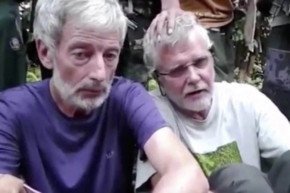 
This image taken from an undated militant video shows Canadians John Ridsdel (R) and Robert Hall. Ridsdel was killed April 25 by Abu Sayyaf militants in the Philippines after more than six months of captivity. (Militant Video via AP Video) 
