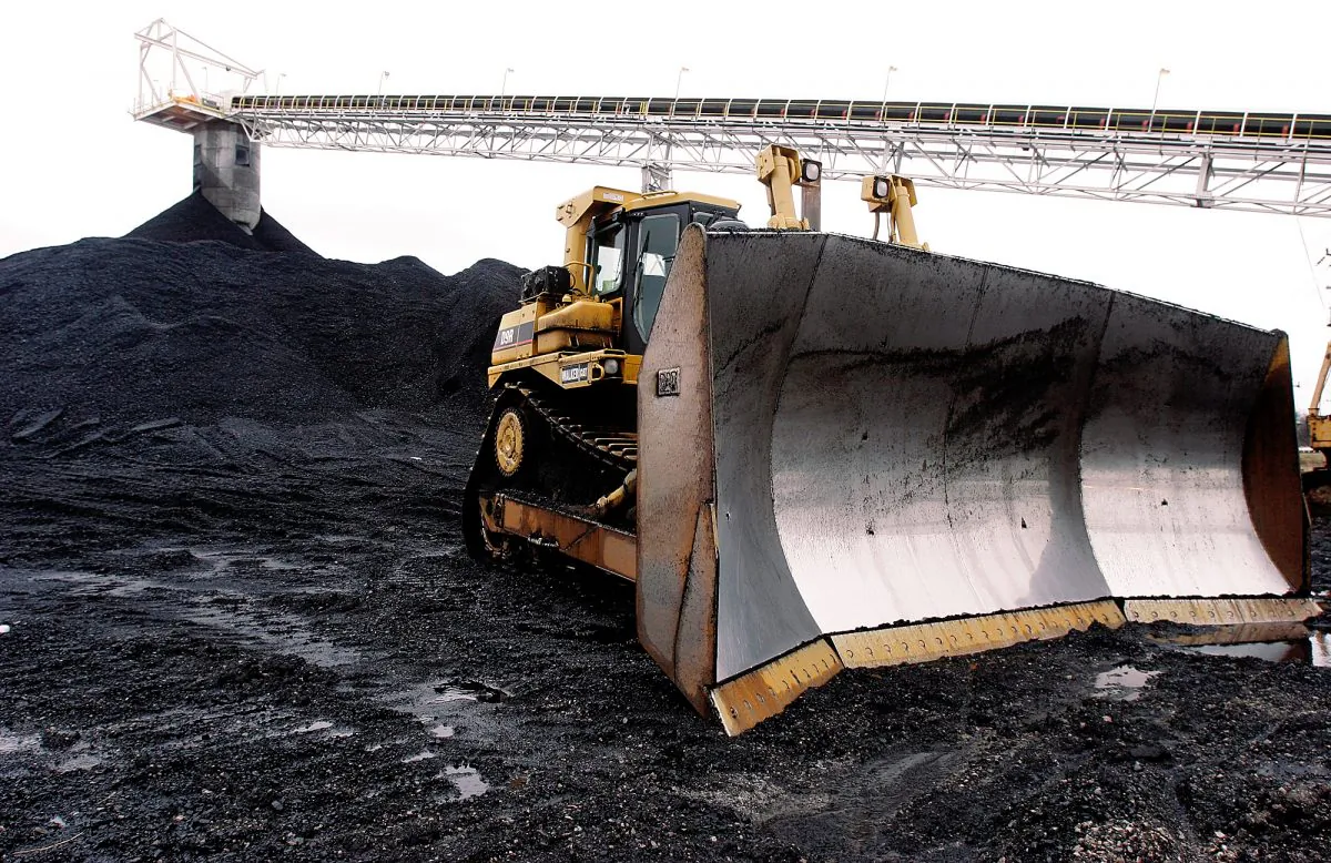 A large bulldozer sits ready for work at Peabody Energy's Gateway Coal Mine near Coulterville, Ill., on March 9, 2006. Illinois' coal production, which peaked in 1918 with a work force of more than 100,000, took a beating in the 1990s after the Clean Air Act required coal-fired power plants to either burn low-sulfur coal or install costly scrubbers to curb the emission of sulfur dioxide, a cause of acid rain. (AP Photo/Seth Perlman)