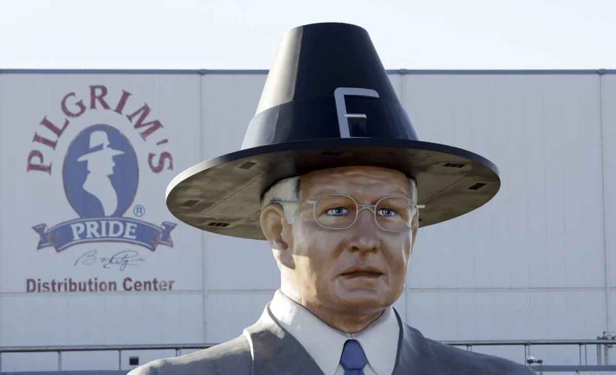 A statue of Pilgrim's Pride founder Bo Pilgrim is displayed outside the company's distribution center near Pittsburg, Texas on Dec. 2, 2008. Brazilian beef producer JBS SA said it would buy a majority stake in Pilgrim's Pride for $800 million. (AP Photo/LM Otero, file)