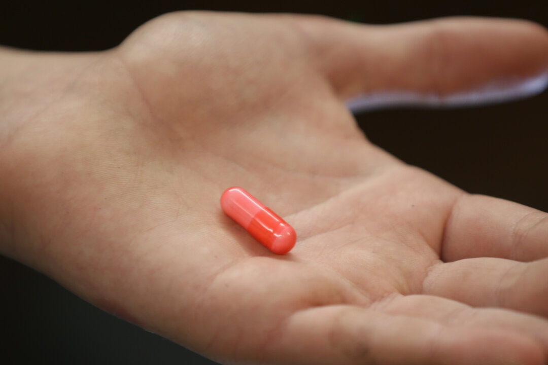 A youth holds a "legal high" chemical pill in Manchester, England, on Feb. 26, 2015. (Christopher Furlong/Getty Images)