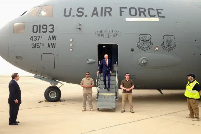 Vice President Joe Biden steps off a C-17 military transport plane upon his arrival in Baghdad, Iraq, Thursday, April 28, 2016. Biden arrived in Baghdad on a visit intended to help Iraqi leaders resolve a political crisis that has hindered efforts to defeat the Islamic State group.  (AP Photo/Josh Lederman)