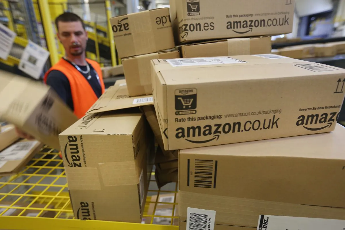 A worker prepares packages for delivery at an Amazon warehouse on in Brieselang, Germany, on Sept. 14, 2014. (Sean Gallup/Getty Images)