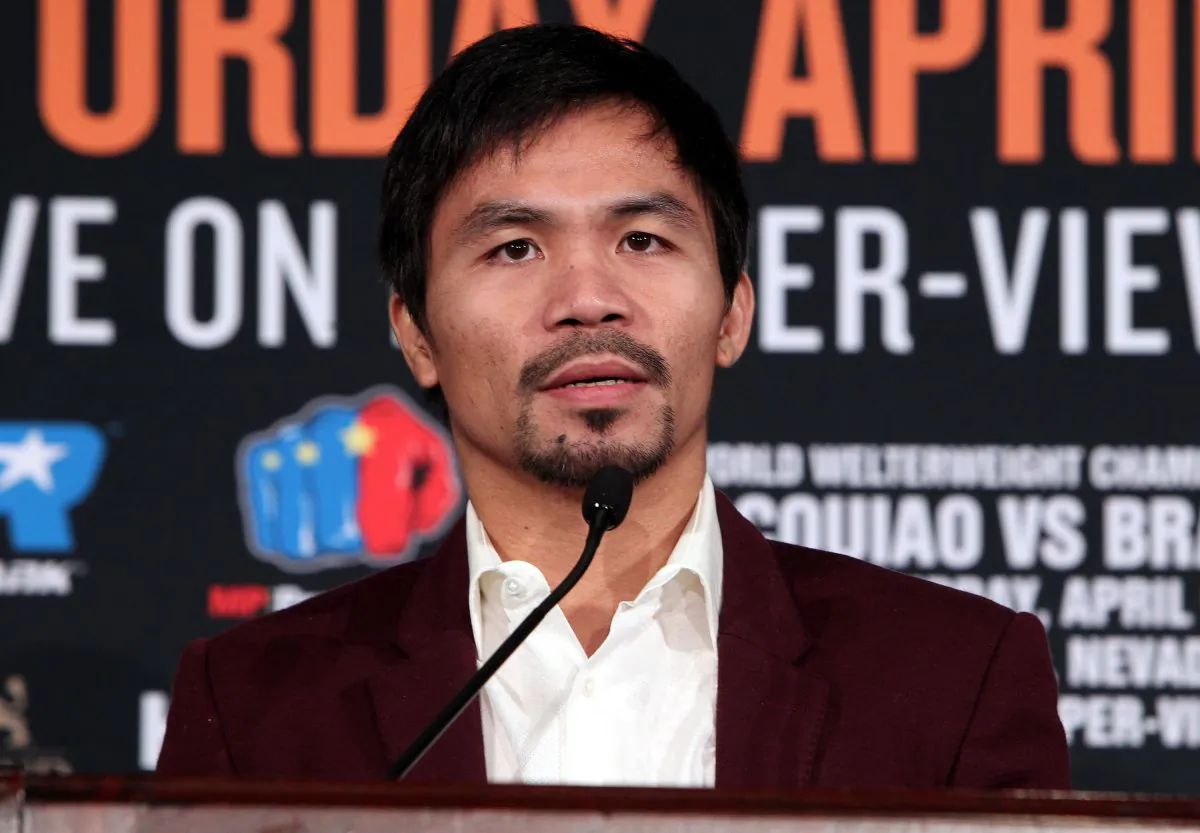 Boxer Manny Pacquiao speaks during a press conference with opponent Timothy Bradley announcing their upcoming 12-round world welterweight championship at the Beverly Hills Hotel in Beverly Hills, California, January 19, 2016.
(Chris Farina/AFP/Getty Images)