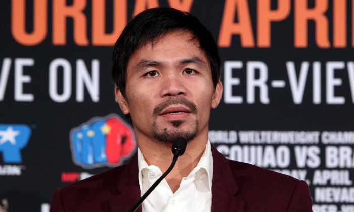 Presidential candidate Manny Pacquiao speaking at a press conference announcing an upcoming 12-round world welterweight championship contest at the Beverly Hills Hotel in  California, Jan. 19, 2016. (Chris Farina/AFP/Getty Images)
