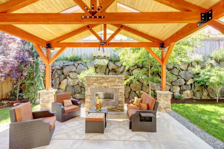 An outdoor entertaining space with a fireplace and comfortable seating. (Courtesy eieihome.com)
