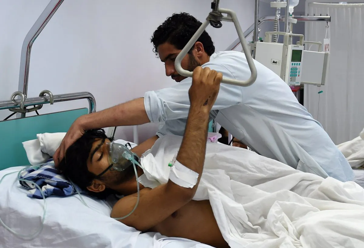 A wounded staff member of Doctors Without Borders (MSF), survivor of the US airstrikes on the MSF Hospital in Kunduz, receives treatment at the Italian aid organization, Emergency's hospital in Kabul on Oct. 6, 2015. (Wakil Kohsar/AFP/Getty Images)