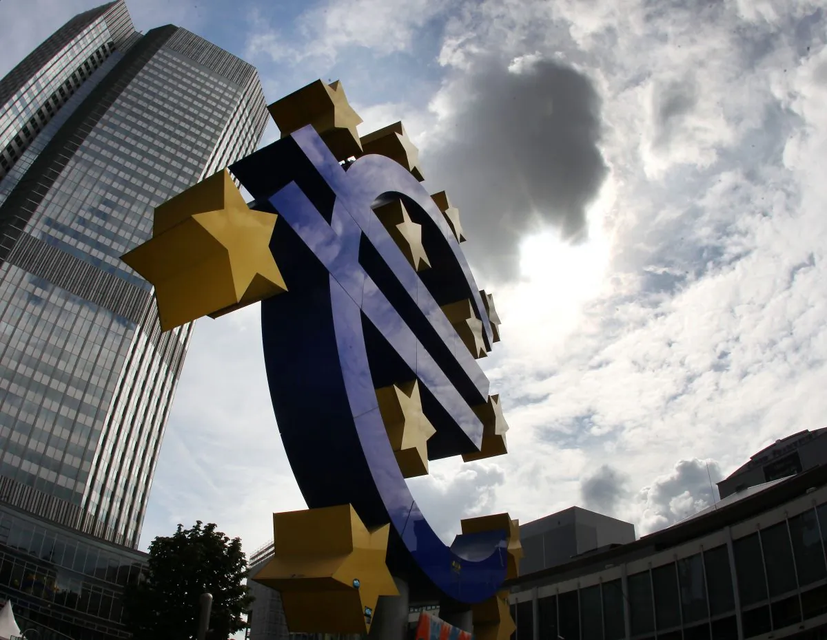 The euro sculpture in front of the headquarters of the European Central Bank (ECB) in Frankfurt, Germany, on July 31, 2012. (AP Photo/Michael Probst)