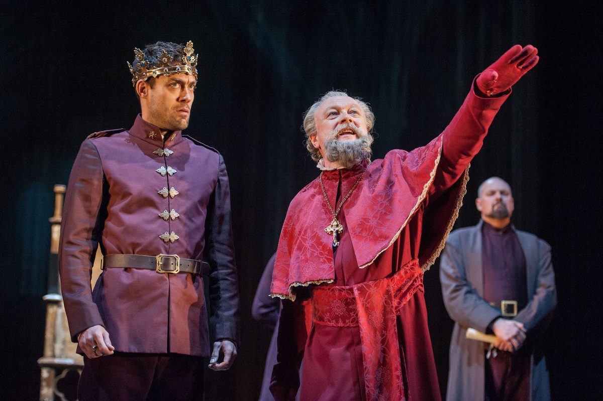 Henry V (Alex Hassell) with the Archbishop of Canterbury (Jim Hooper) in the last in the cycle of king plays at the Brooklyn Academy of Music, “Henry V.” (Stephanie Berger)