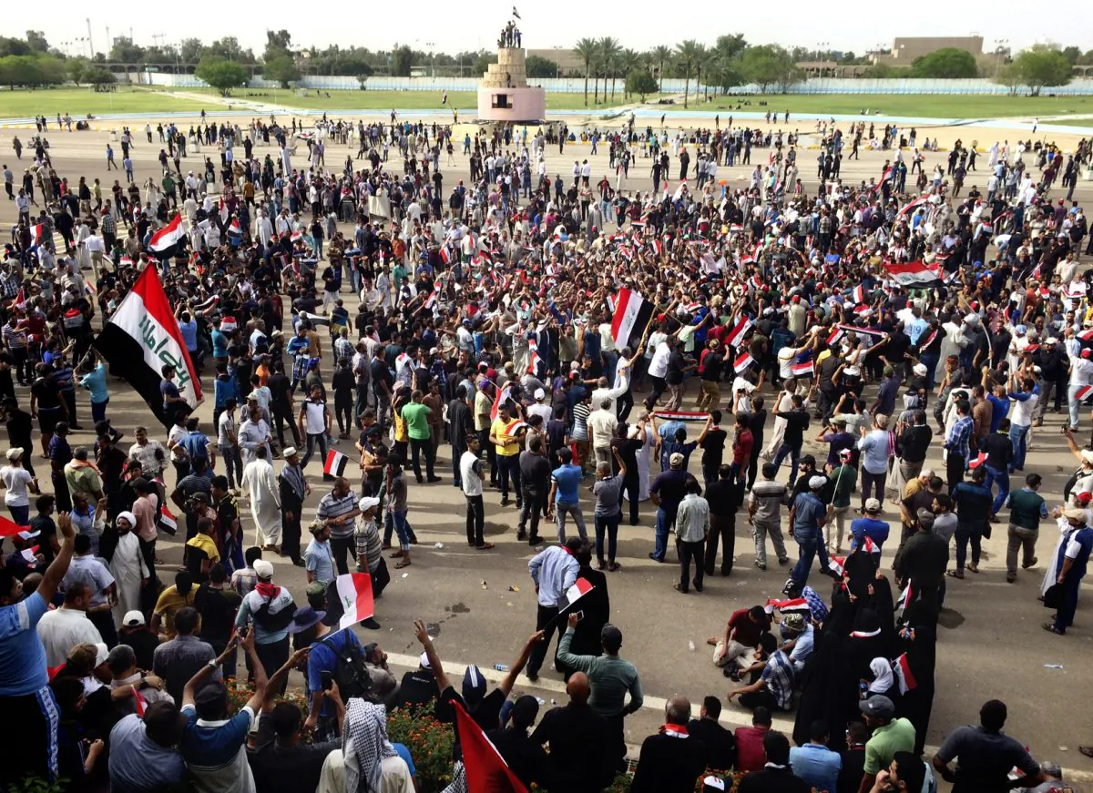 Supporters of Shiite cleric Muqtada al-Sadr attend a sit-in inside Baghdad's highly fortified Green Zone on May 1, 2016. Anti-government protesters tore down walls and poured into the Iraqi capital's heavily fortified Green Zone yesterday, where they stormed parliament in a major escalation of a political crisis that has simmered for months. (AP Photo/Karim Kadim)