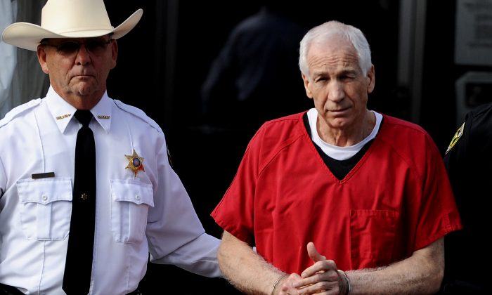 Former Penn State assistant football coach Jerry Sandusky was sentenced to at least 30 years and not more that 60 years in prison for his conviction in June on 45 counts of child sexual abuse. (Patrick Smith/Getty Images)