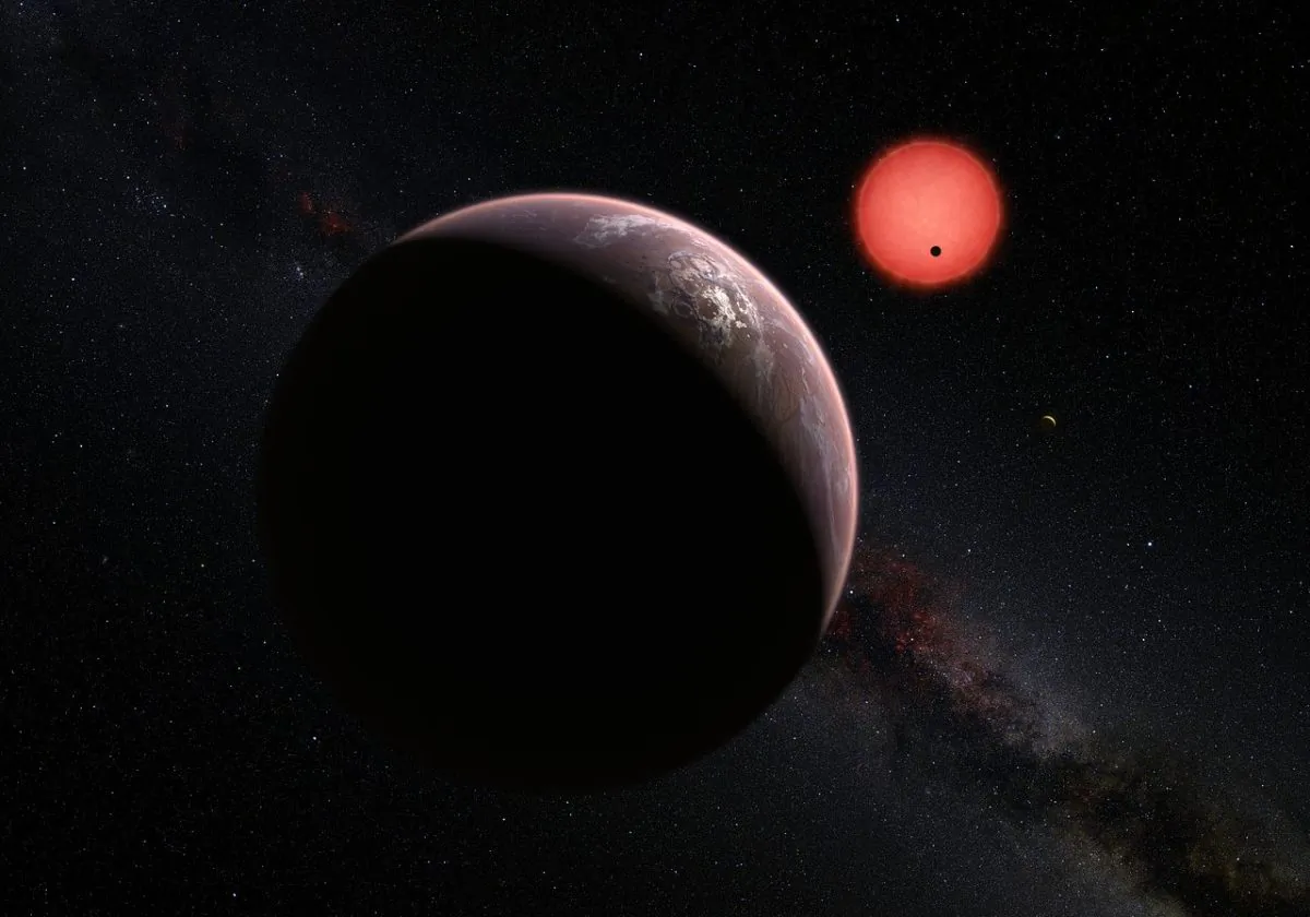 This artist’s impression shows an imagined view of the three planets orbiting an ultracool dwarf star just 40 light-years from Earth that were discovered using the TRAPPIST telescope at ESO’s La Silla Observatory. (ESO/M. Kornmesser/N. Risinger (skysurvey.org))