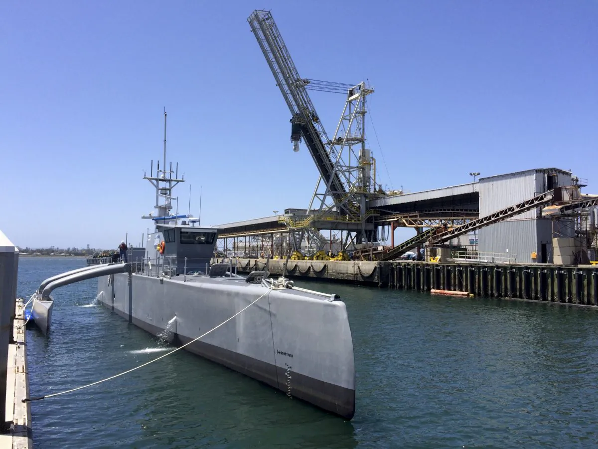 A self-driving, 132-foot military ship sits at a maritime terminal in San Diego on May 2, 2016. (AP Photo/Julie Watson)