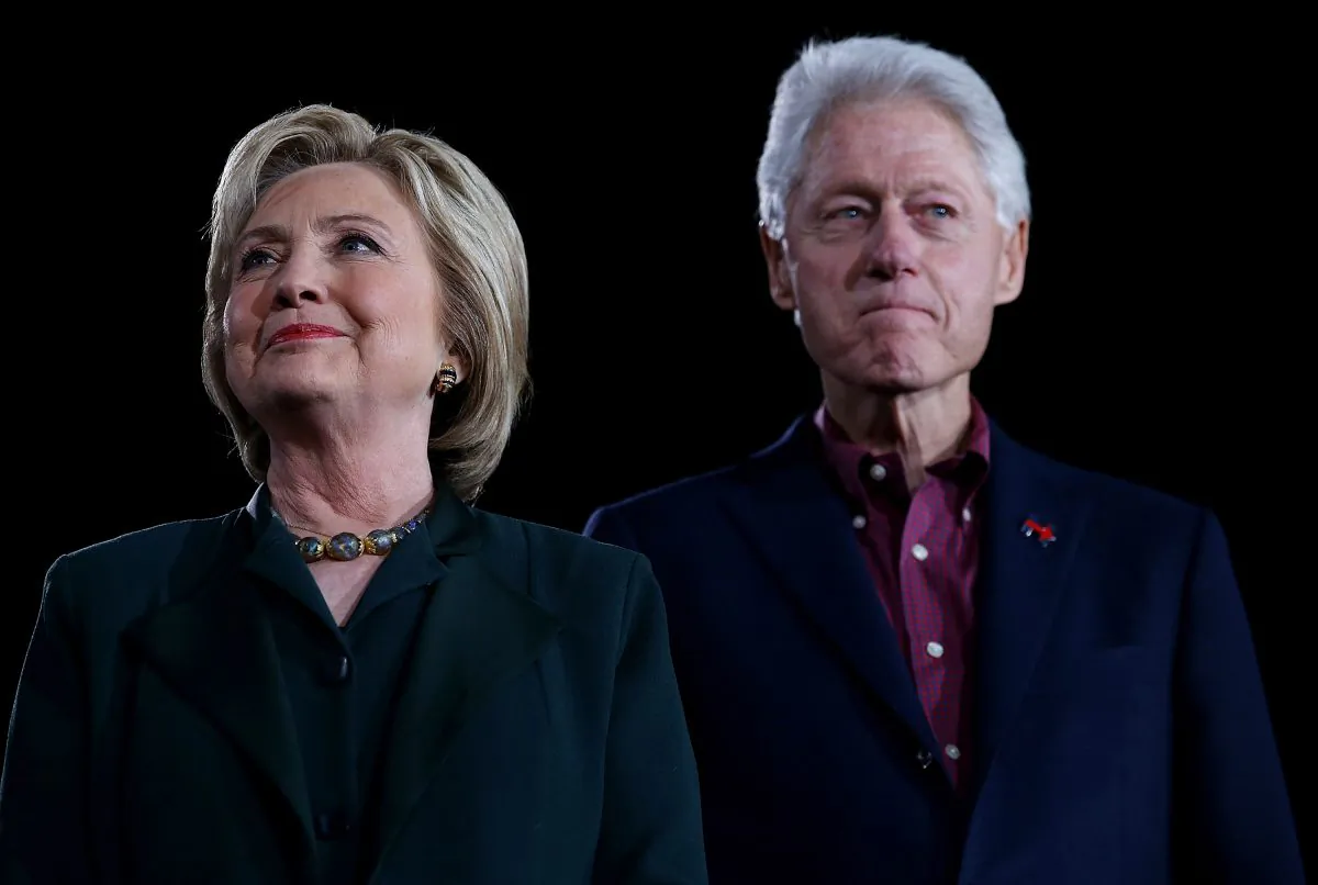 Democratic presidential candidate former Secretary of State Hillary Clinton and her husband, former U.S. president Bill Clinton look on during a "Get Out The Caucus" at the Clark County Government Center on February 19, 2016 in Las Vegas, Nevada. (Justin Sullivan/Getty Images)