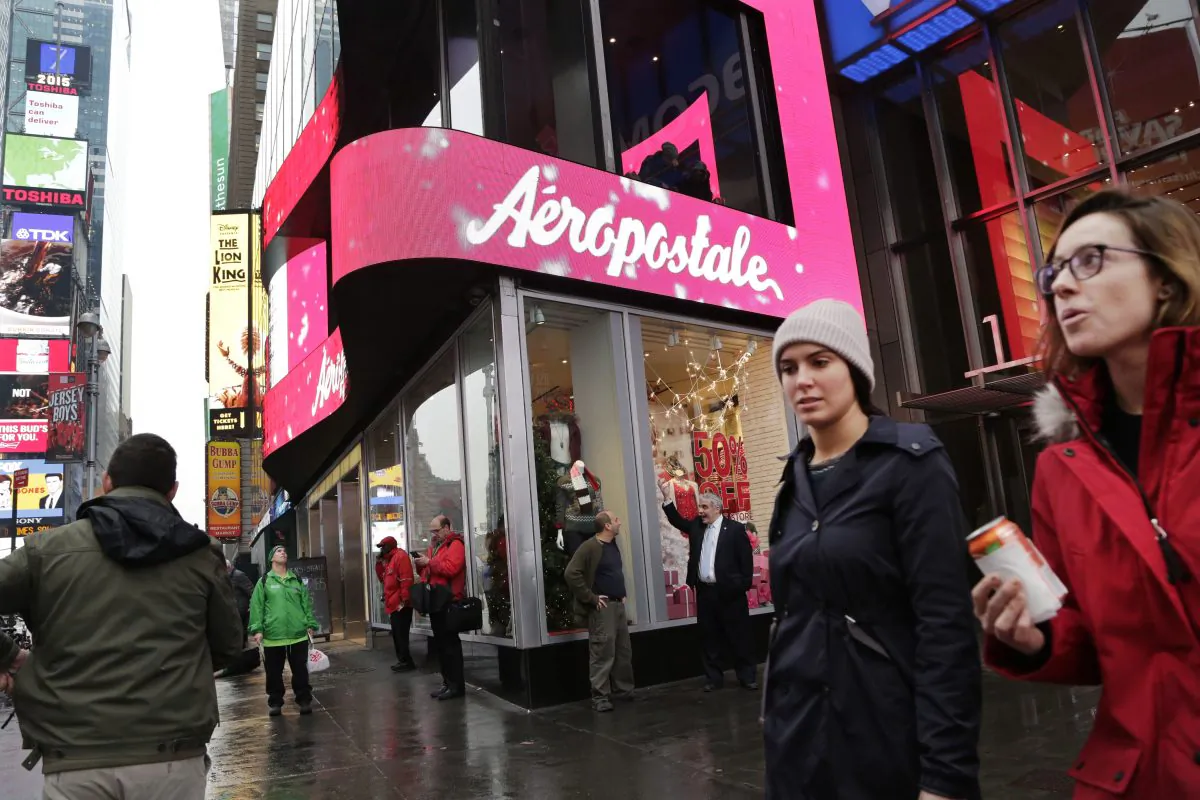 In this Wednesday, Dec. 2, 2015, file photo, women pass an Aeropostale clothing store in New York's Times Square. Aeropostale, once the vibrant epicenter of the U.S. mall scene, announced Wednesday, May 4, 2016, it is seeking Chapter 11 bankruptcy protection. (AP Photo/Mark Lennihan, File)