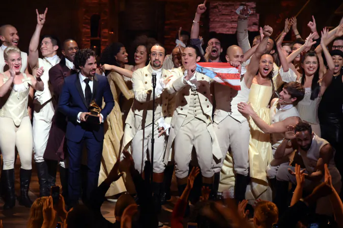 Music director Alex Lacamoire and Actor, composer Lin-Manuel Miranda celebrate on stage during 'Hamilton' GRAMMY performance for The 58th GRAMMY Awards at Richard Rodgers Theater on February 15, 2016 in New York City. (Photo by Theo Wargo/Getty Images)