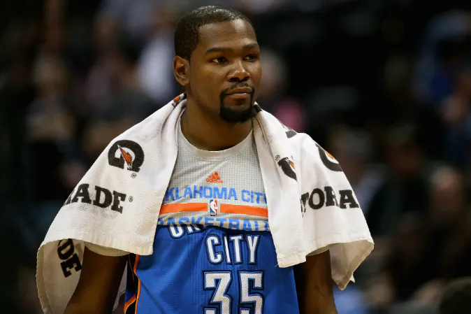  Kevin Durant #35 of the Oklahoma City Thunder looks on from the bench late in the game against the Denver Nuggets at Pepsi Center on April 5, 2016 in Denver, Colorado. (Photo by Doug Pensinger/Getty Images)