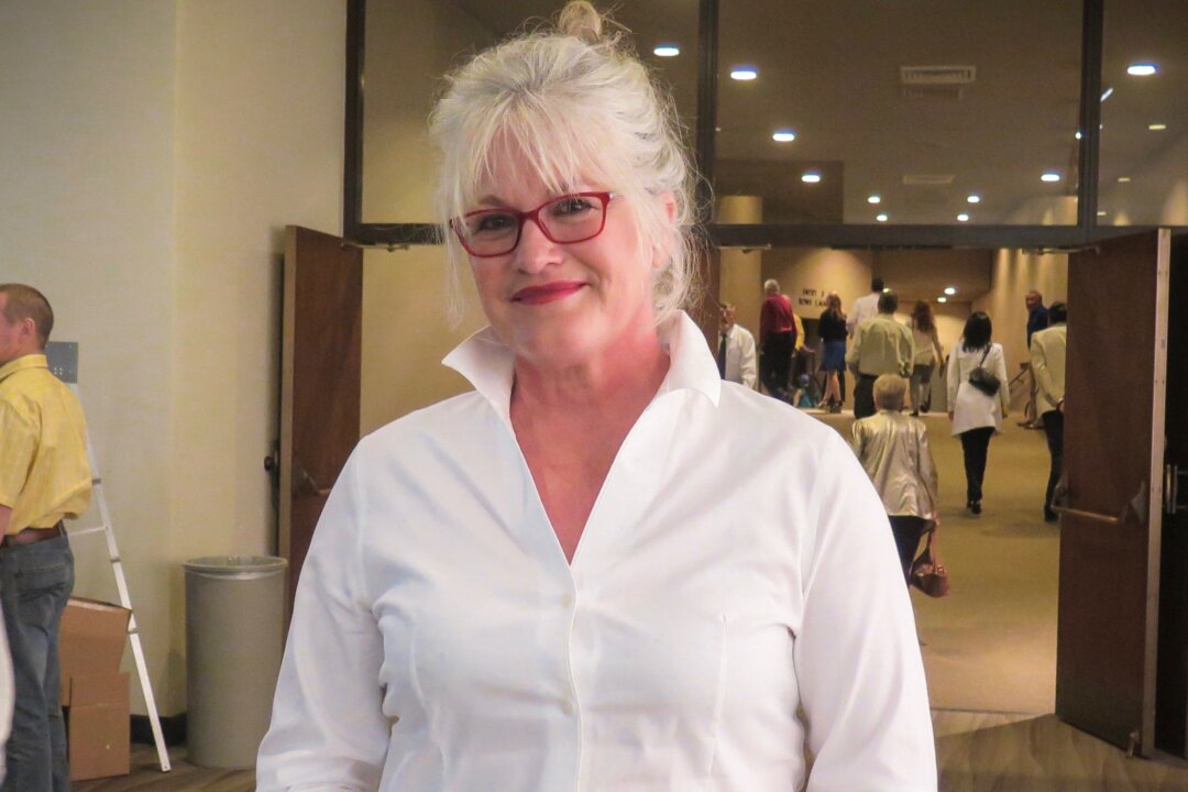 Lori Craine felt moved by Shen Yun Performing Arts, which she saw at the Century II Performing Arts & Convention Center for the Midwest's final performance. (Cat Rooney/Epoch Times)