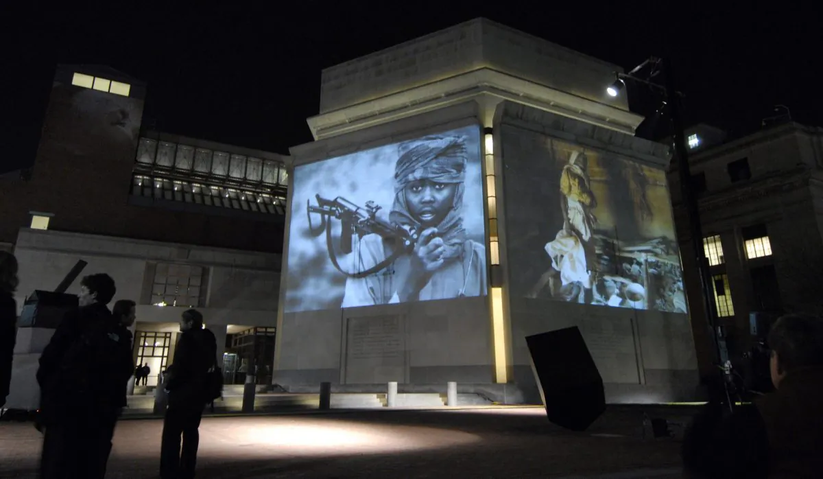 Images from Darfur and Chad are projected on the exterior walls of the United States Holocaust Memorial Museum in Washington, Nov. 20, 2006. (AP Photo/Nick Wass)
