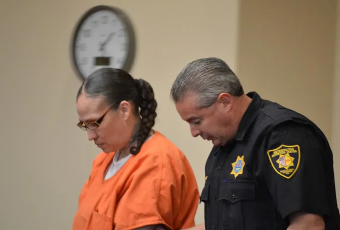 Synthia Varela-Casaus, an Albuquerque, N.M., mother who pleaded guilty in one of the state's most high-profile child abuse deaths, stands in a Bernalillo County courtroom in Albuquerque, Friday, May 6, 2016. Varela-Casaus was sentenced Friday to 40 years in prison in connection with the 2013 death of her 9-year-old son, Omaree. The case drew national attention since Omaree tried unsuccessfully to get help from authorities because of previous abuse. (AP Photo/Russell Contreras)
