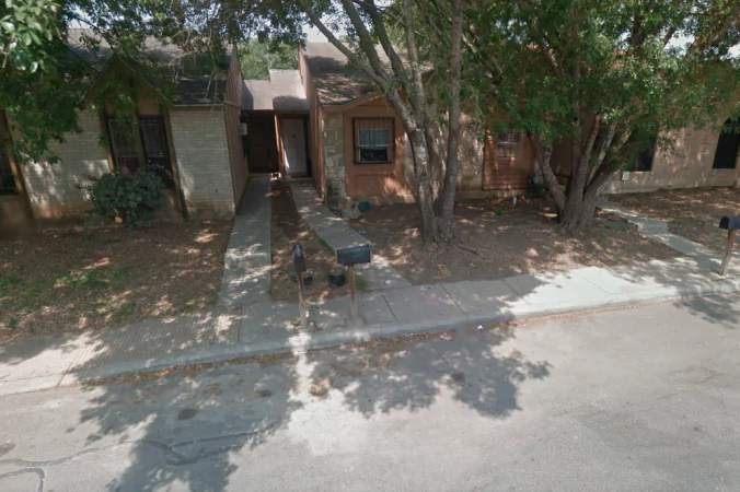 The house where Bexar County Sheriff's Office deputies located 8 unsupervised children; 2 of them chained up in the backyard. (Google Maps image)