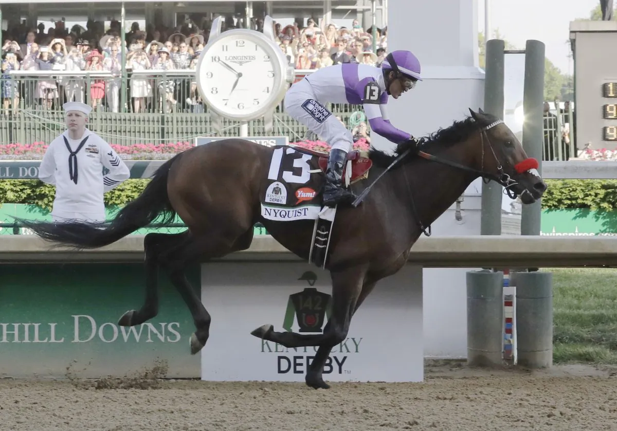 Mario Guitierrez rides Nyquist to victory during the 142nd running of the Kentucky Derby horse race at Churchill Downs Saturday, May 7, 2016, in Louisville, Ky. (AP Photo/Morry Gash)