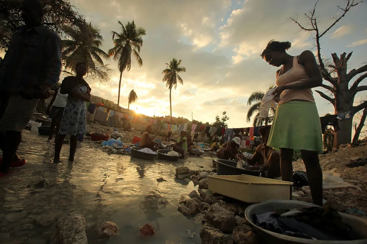Haitians wash clothes in a stream in Port-au-Prince, Haiti, on Jan. 8, 2011. (Mario Tama/Getty Images)