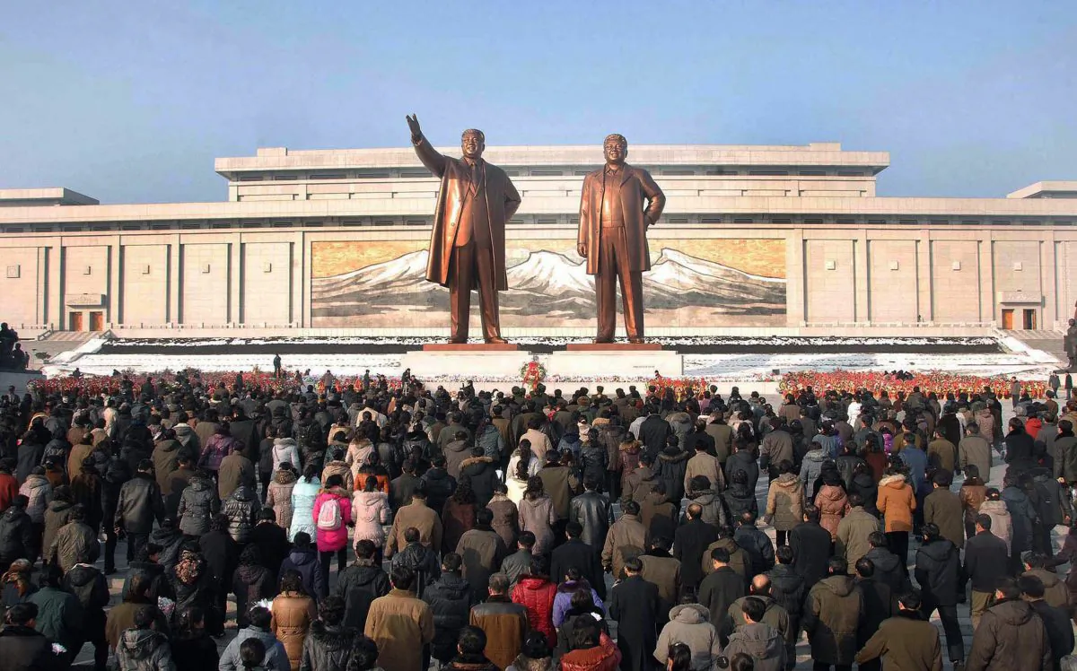 North Koreans visit the Mansu Hill in Pyongyang before statues of late President Kim Il-sung and leader Kim Jong-il on the first anniversary of leader Kim Jong-Il's death on Dec. 17, 2012. (KNS/AFP/Getty Images)