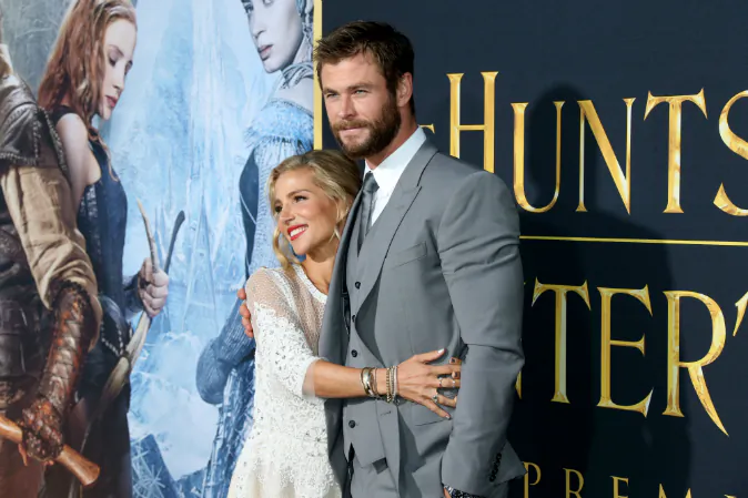 Actor Chris Hemsworth (R) and wife Elsa Pataky (L) attend the premiere of Universal Pictures' 'The Huntsman: Winter's War' at the Regency Village Theatre on April 11, 2016 in Westwood, California. (Photo by Frederick M. Brown/Getty Images)