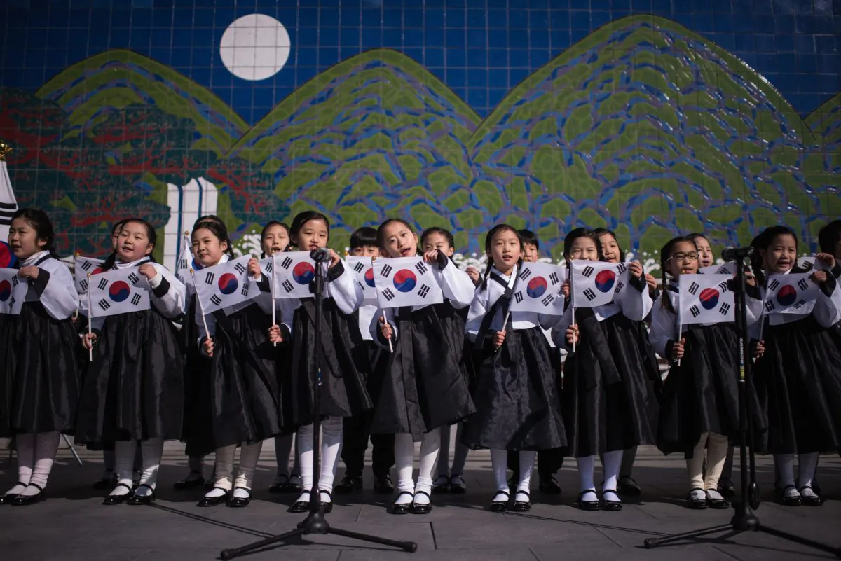 South Korean students wearing traditional costumes mark the 97th Independence Movement Day in Seoul on March 1, 2016. (Ed Jones/AFP/Getty Images)