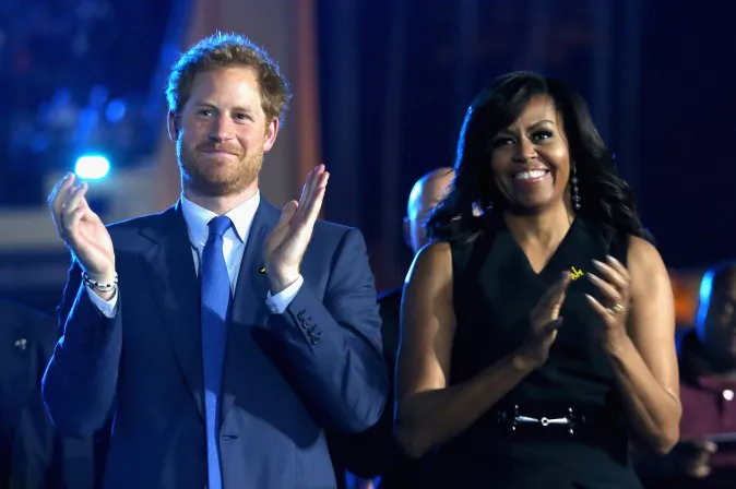 Prince Harry and Michelle Obama cheer during the Opening Ceremony of the Invictus Games Orlando 2016 at ESPN Wide World of Sports on May 8, 2016 in Orlando, Florida. Prince Harry, patron of the  Invictus Games Foundation is in Orlando ahead of the opening of Invictus Games which will open on Sunday. The Invictus Games is the only International sporting event for wounded, injured and sick servicemen and women. Started in 2014 by Prince Harry the Invictus Games uses the power of Sport to inspire recovery and support rehabilitation.  (Photo by Chris Jackson/Getty Images for Invictus)