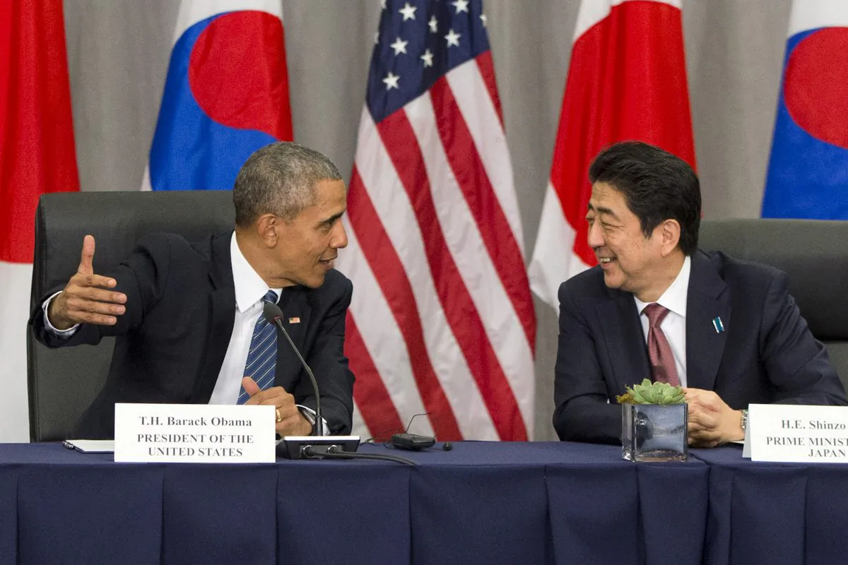 FILE - In this March 31, 2016, file photo, U.S. President Barack Obama speaks with Japanese Prime Minister Shinzo Abe during their meeting at the Nuclear Security Summit in Washington. Obama will travel to Hiroshima in May 2016 in the first visit by a sitting American president to the site where the U.S. dropped an atomic bomb. The White House says Obama will visit along with Abe during a previously scheduled visit to Japan. (AP Photo/Jacquelyn Martin, File)
