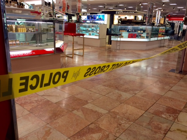 Crime scene tape is seen inside the Macy's at the Silver City Galleria mall in Taunton, Mass., Tuesday, May 10, 2016. Multiple people have been stabbed separate attacks at the mall and a home in Massachusetts. (Charles Winokoor/The Daily Gazette via AP) MANDATORY CREDIT