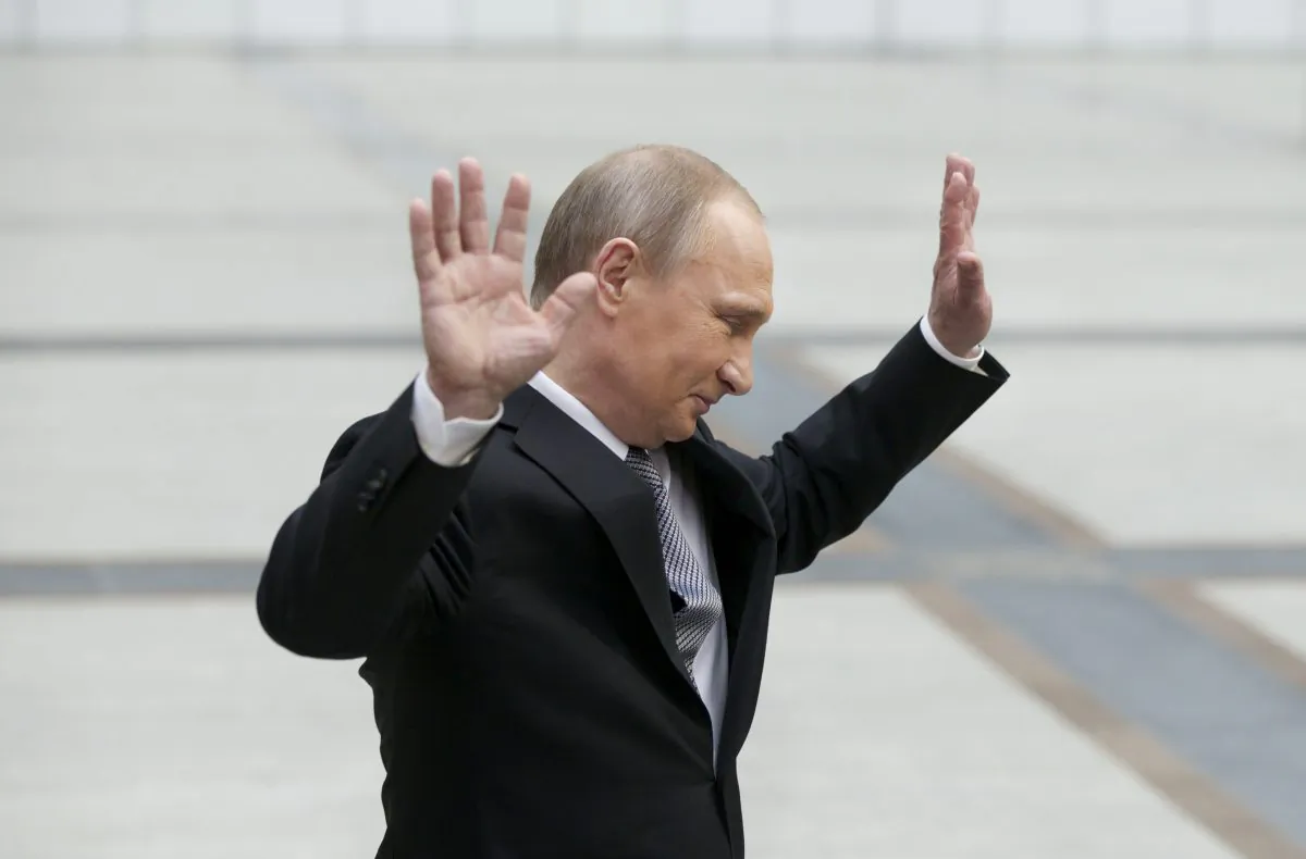 Russian President Vladimir Putin gestures after speaking to the media after his marathon call-in TV show in Moscow, Russia, on April 14, 2016. (AP Photo/Alexander Zemlianichenko)