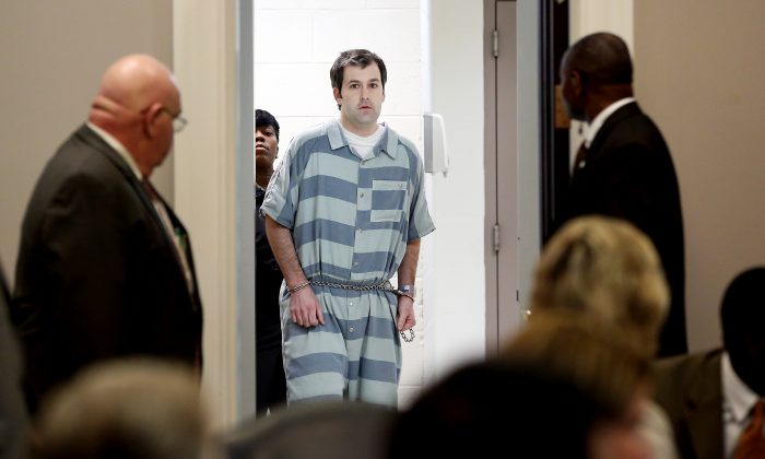 Former North Charleston officer Michael Slager (C) is lead into court for a bond hearing at the Charleston County Court House September 10, 2015 in Charleston, South Carolina. Slager is charged with the murder of Walter Scott. Slager shot Scott in the back when Scott ran away during a traffic stop on April 4th in 2015. (Photo by Grace Beahm-Pool/Getty Images)