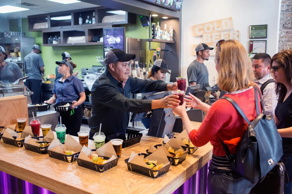A worker serves customers at a Taco Bell Cantina restaurant in Chicago, Ill., on Sept. 22, 2015. (Scott Olson/Getty Images)
